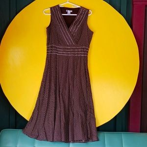 Carole little. Brown and white polka dot dress.